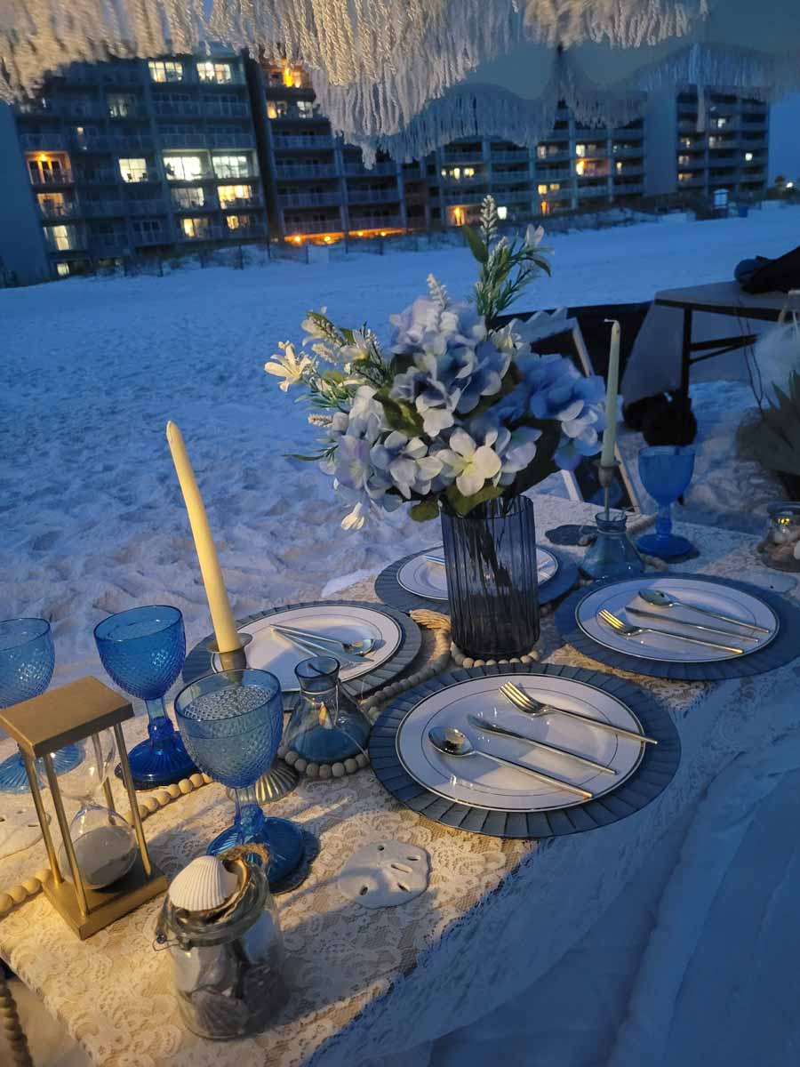 Tides and Tassels Party planning beach romantic dinner setup Tides and Tassels Party planning beach romantic dinner setup